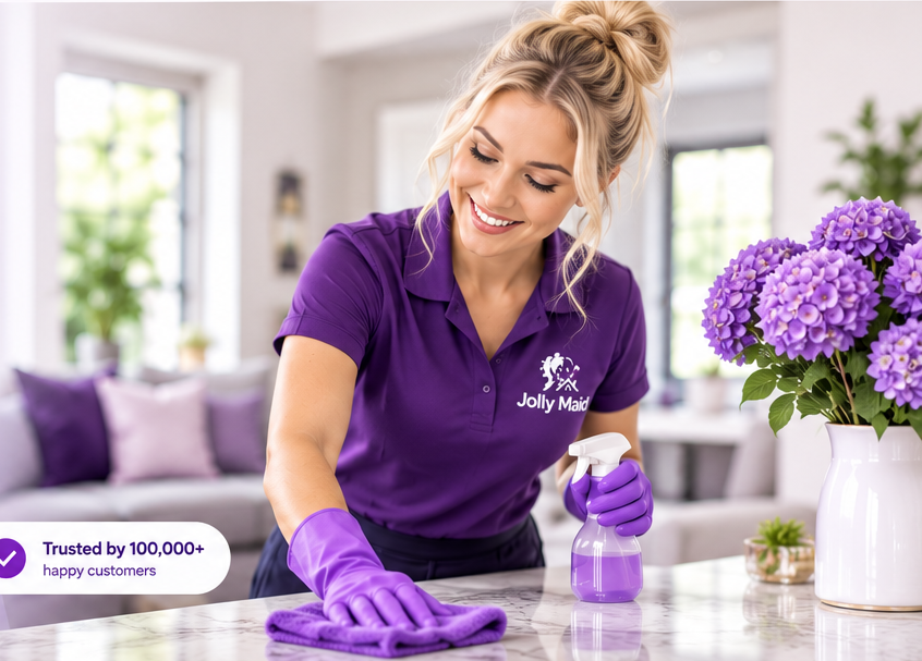 Professional cleaner carefully cleaning a bright home